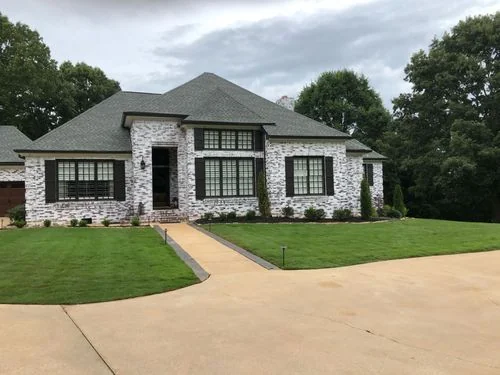 Well-established lawn with curved driveway